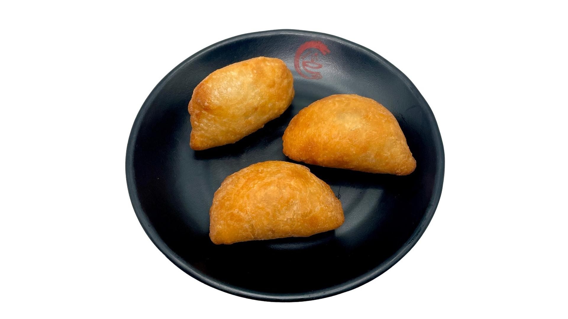 Fried savory dumplings with golden crust at E Noodle, a Chinese Restaurant in Brooklyn