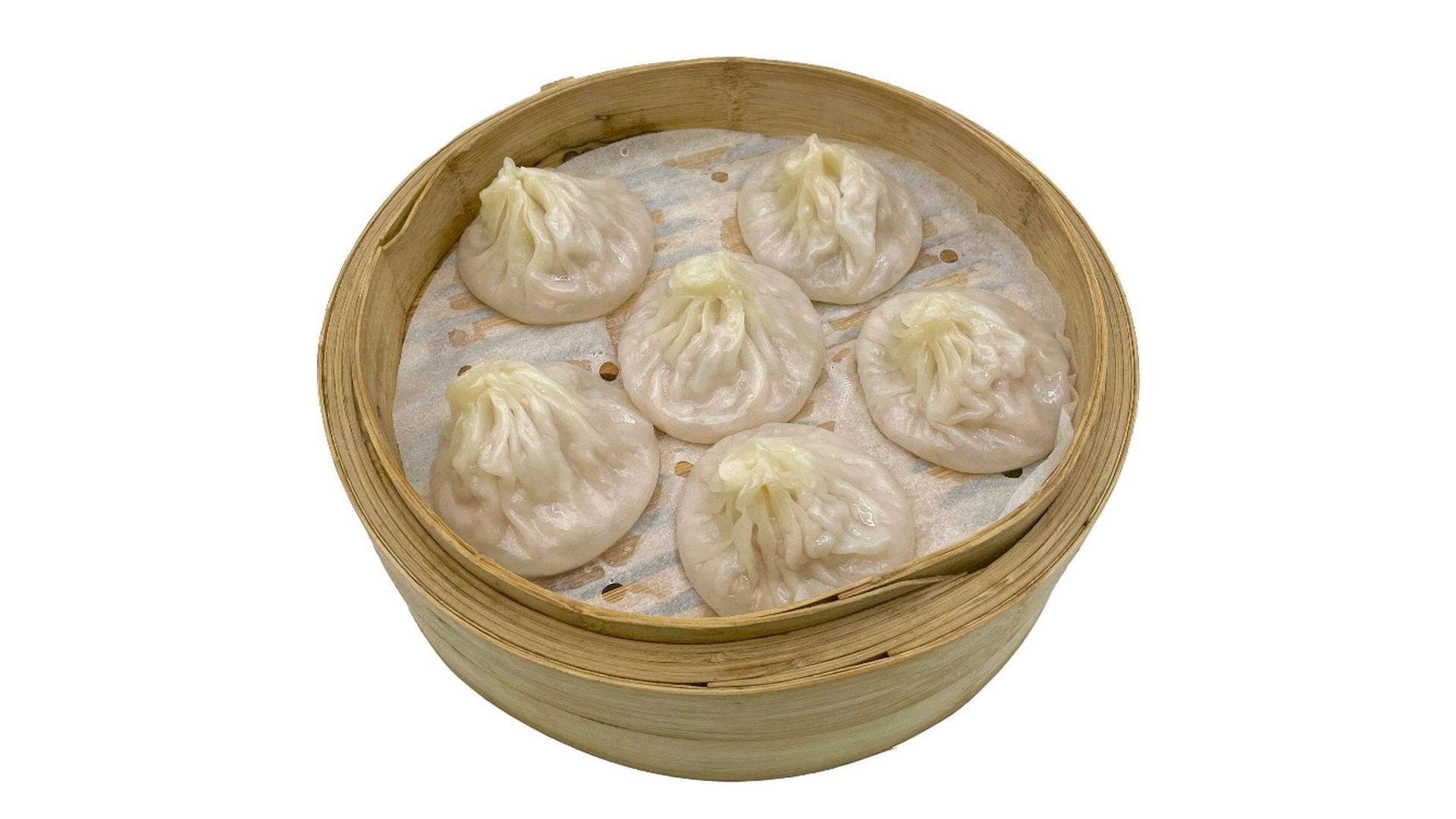 Soup dumplings served in bamboo steamer at E Noodle, a Chinese Restaurant in Brooklyn