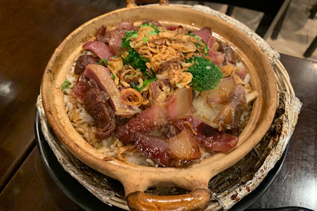 Clay pot rice mixed with cured pork sausages, broccoli and crispy fried shallots at E Noodle Chinatown, a Chinese Restaurant in New York