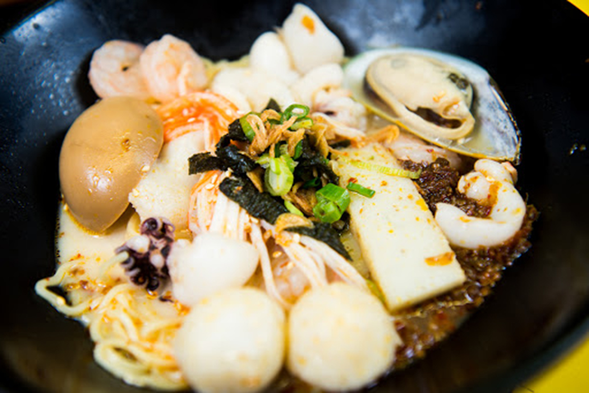 Rich tonkotsu seafood ramen with shrimp, mussel, squid and fish balls at E Noodle Chinatown, a Chinese Restaurant in New York
