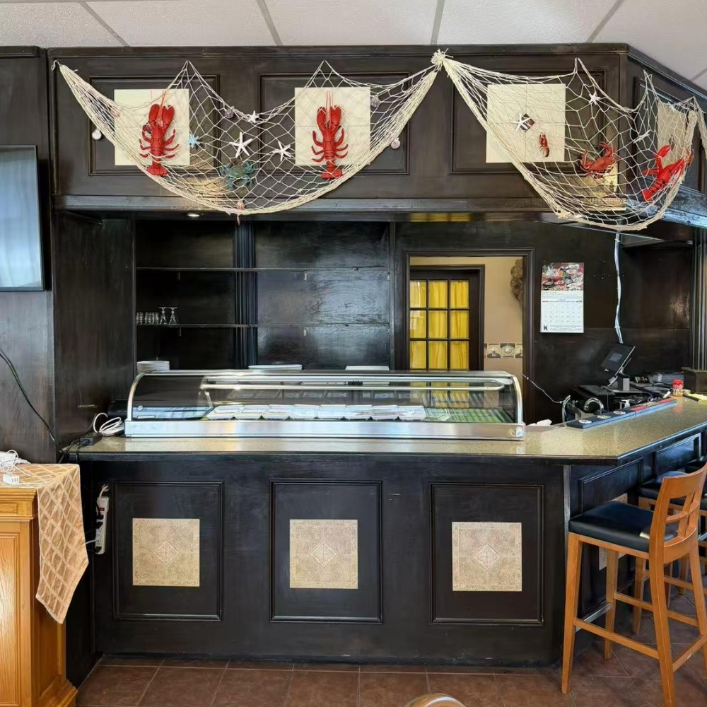 Restaurant counter with seafood decor at Raku Sushi, a Japanese Restaurant in Easton
