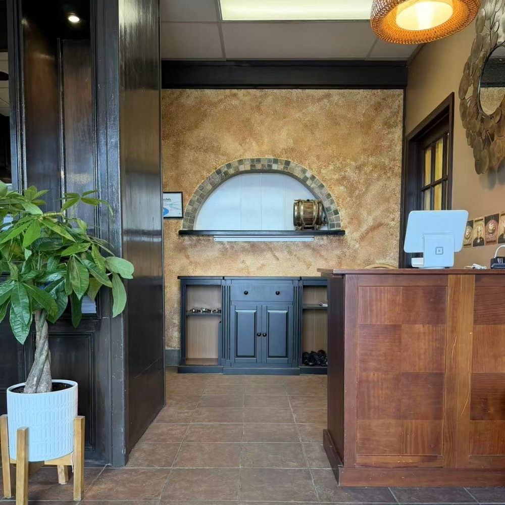 Restaurant entrance with plants at Raku Sushi, a Japanese Restaurant in Easton