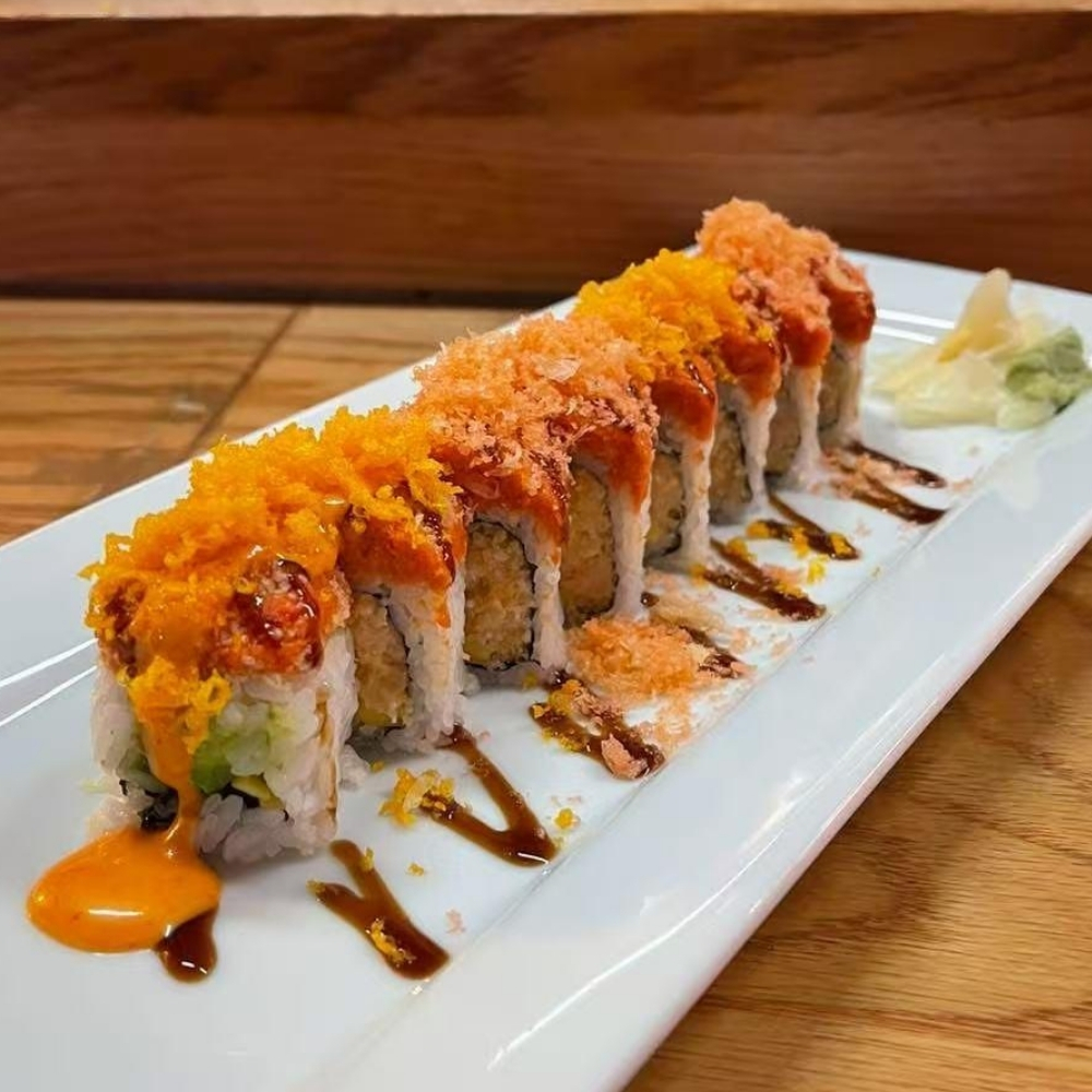 Tobiko-crusted sushi roll with sauces at Raku Sushi, a Japanese Restaurant in Easton