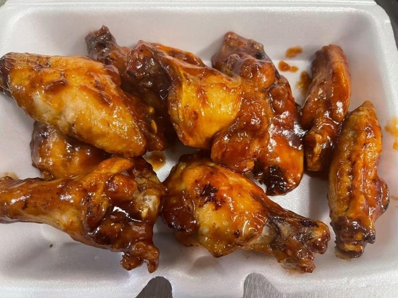 EZ-YUMMY-FOOD-Asian-Restaurant-BBQ-wings-Ahoskie Succulent chicken wings coated in a savory BBQ sauce, served in a foam container at EZ YUMMY FOOD, a Asian Restaurant in Ahoskie