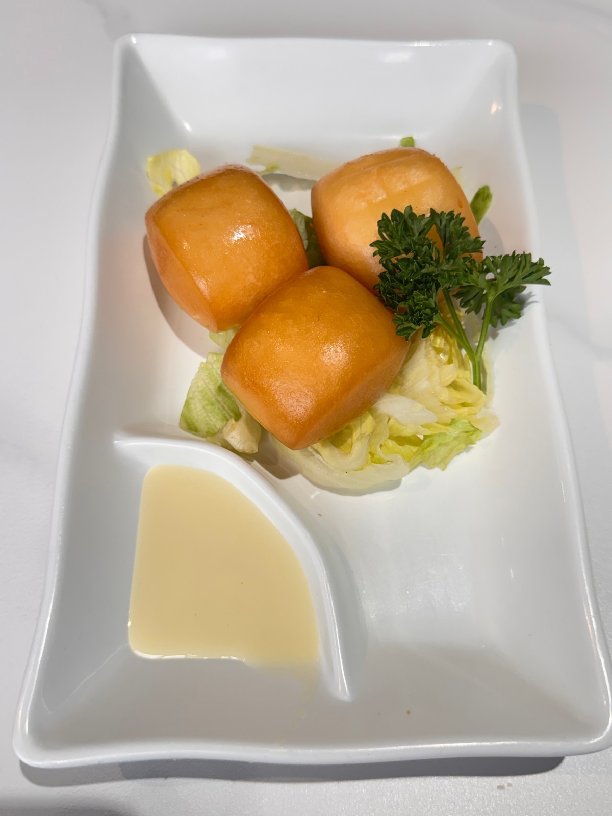 Crispy fried buns with sweet condensed milk dip at Takumi, a Japanese Restaurant in Fairview Heights