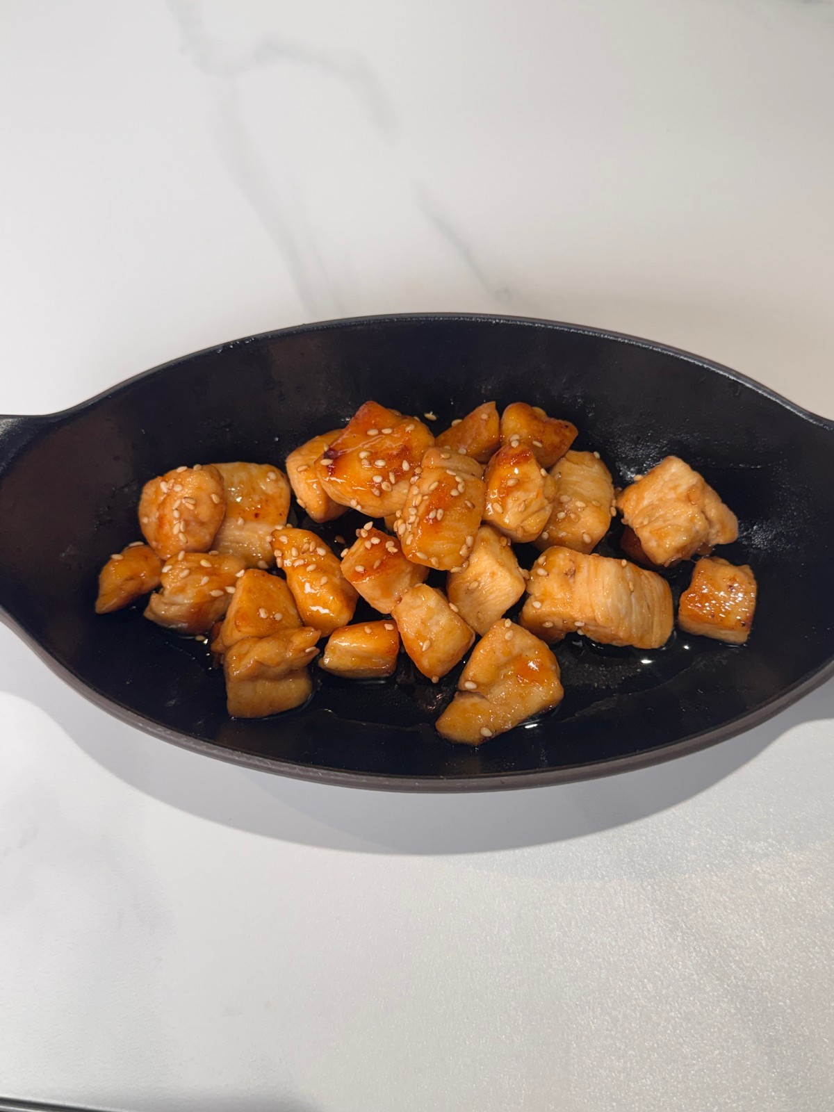 Grilled teriyaki chicken bites with sesame seeds at Takumi, a Japanese Restaurant in Fairview Heights