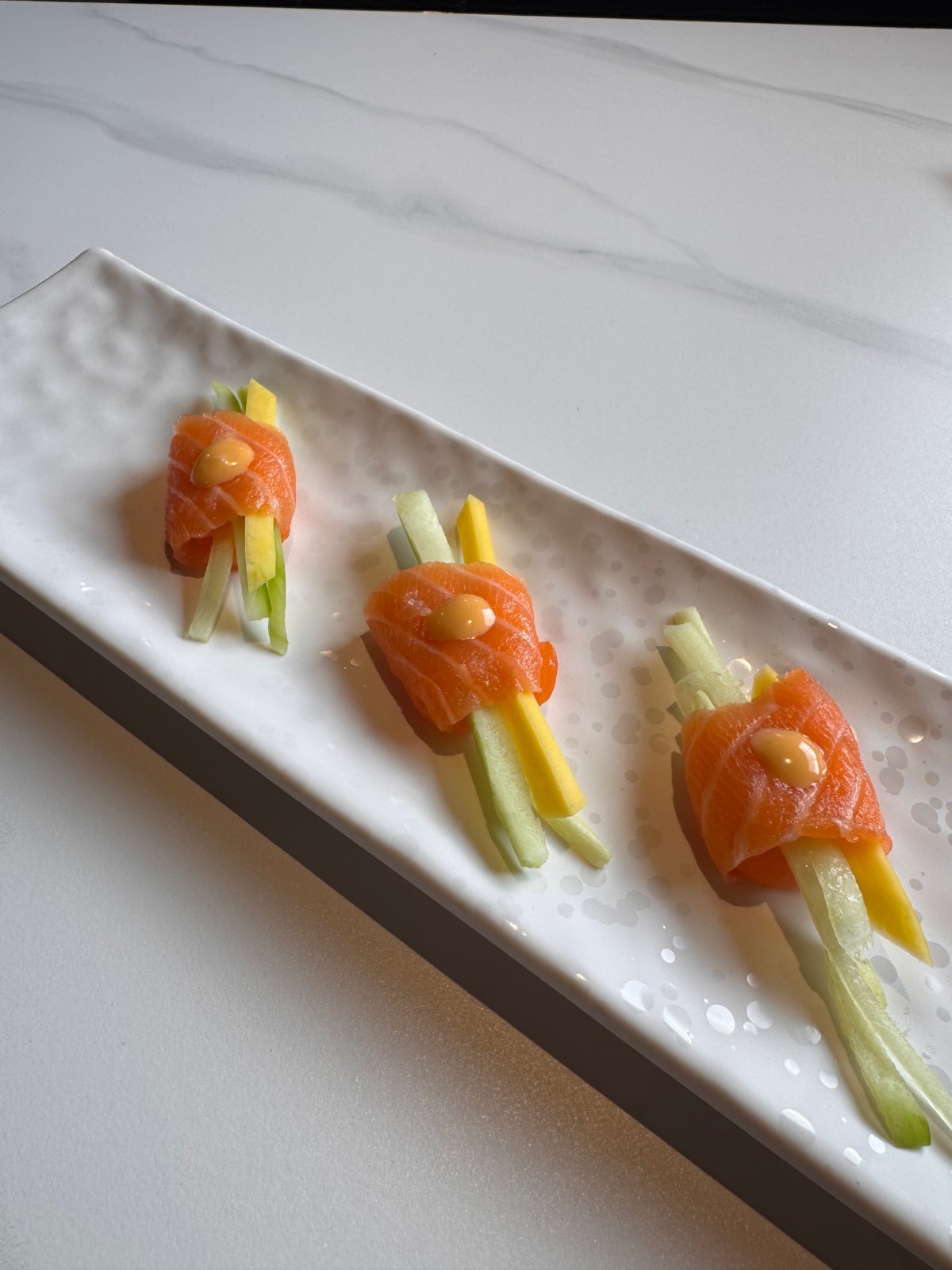 Salmon sashimi rolls with mango, cucumber and spicy mayo at Takumi, a Japanese Restaurant in Fairview Heights
