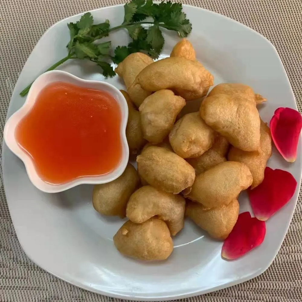 Fried chicken nuggets with sweet and sour sauce at Family Kitchen, an Chinese Restaurant in Brooklyn.