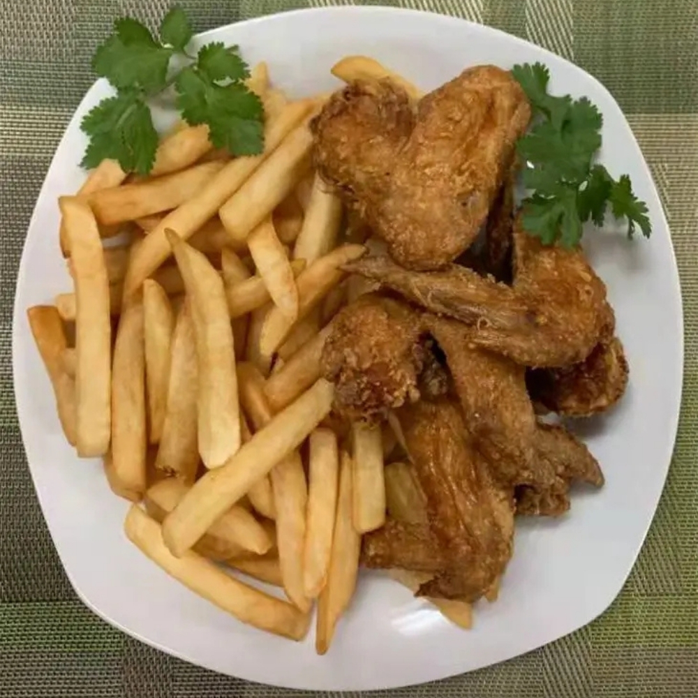 Fried chicken wings with fries at Family Kitchen, an Chinese Restaurant in Brooklyn.