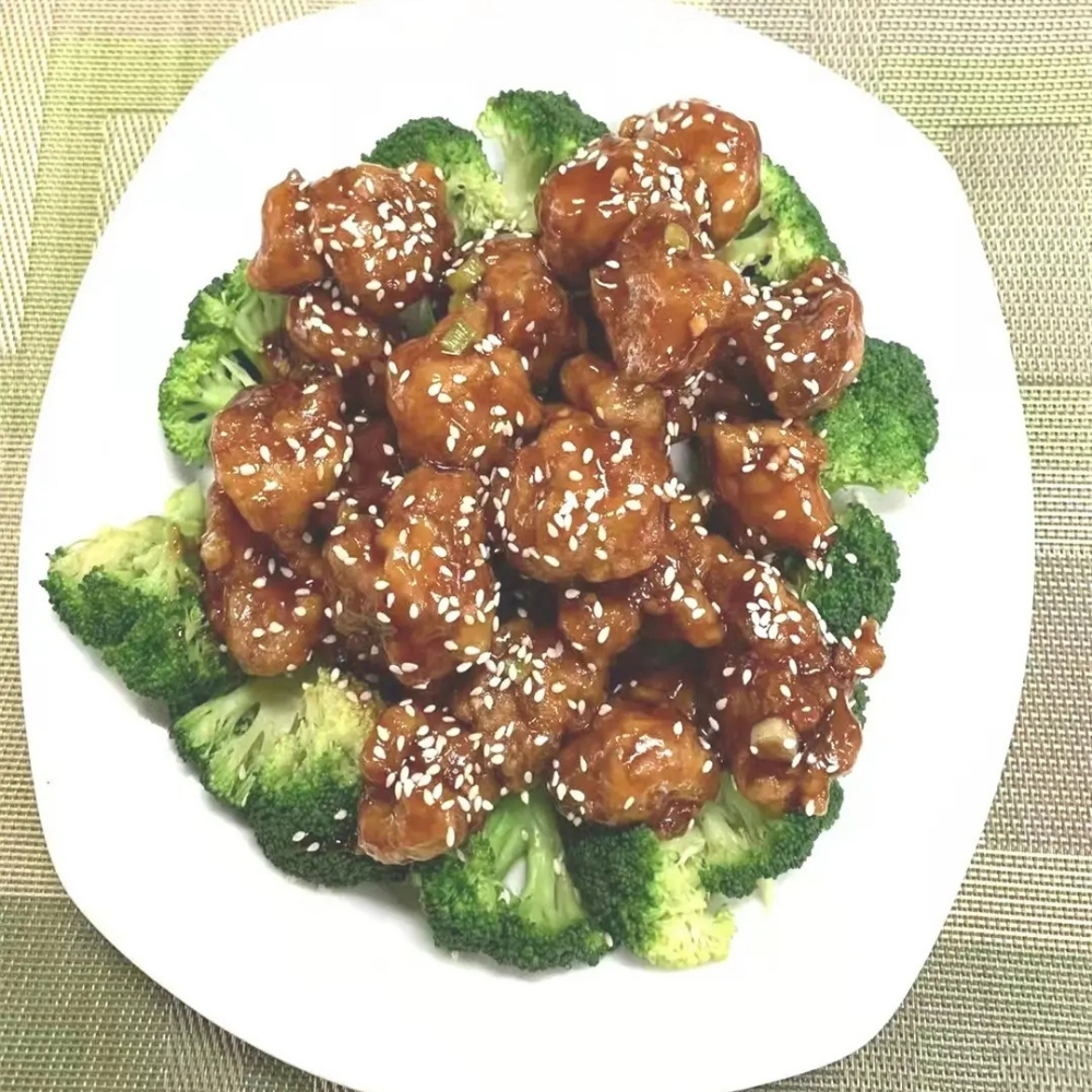 Sesame chicken with broccoli at Family Kitchen, an Chinese Restaurant in Brooklyn.