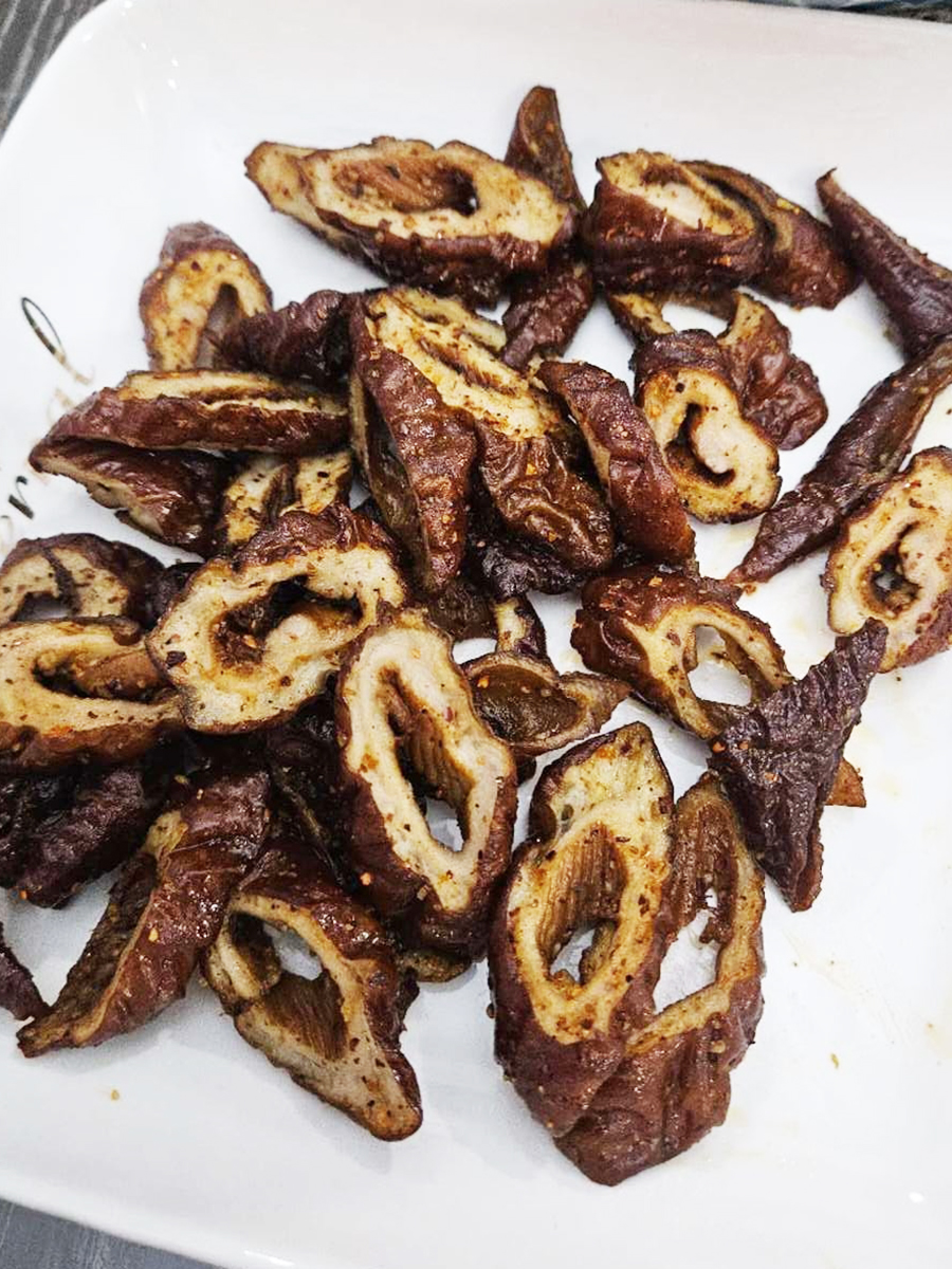 Salt and Pepper Marinated Pork Intestines, crispy and flavorful, a popular dish at Fang's Wok，a Asian Restaurant in Plano