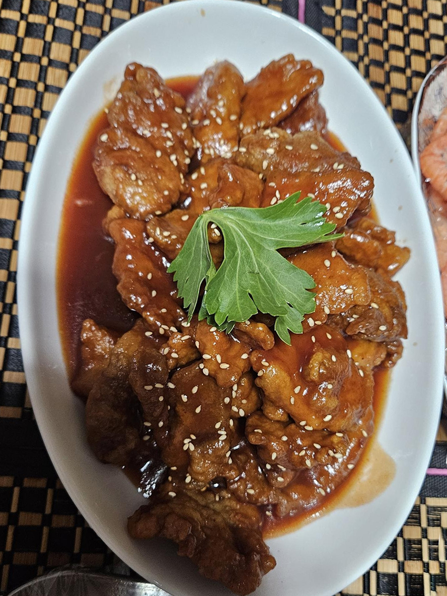 Sweet and Sour Pork Fillet, a classic Chinese dish with crispy pork and sweet - sour sauce at Fang's Wok，a Asian Restaurant in Plano
