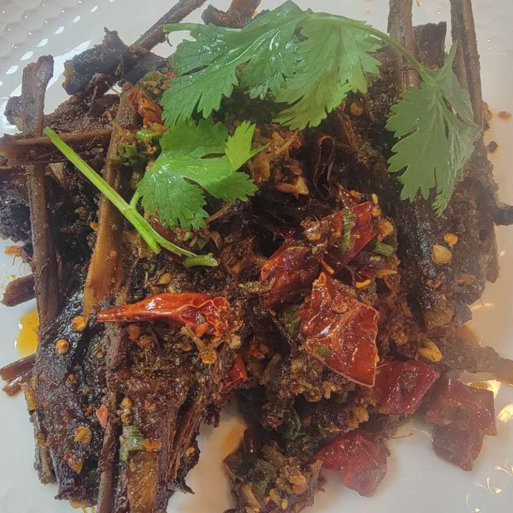 Spicy dried duck tongue with chili and cilantro at Farmer kitchen, a Chinese Restaurant in Monterey Park