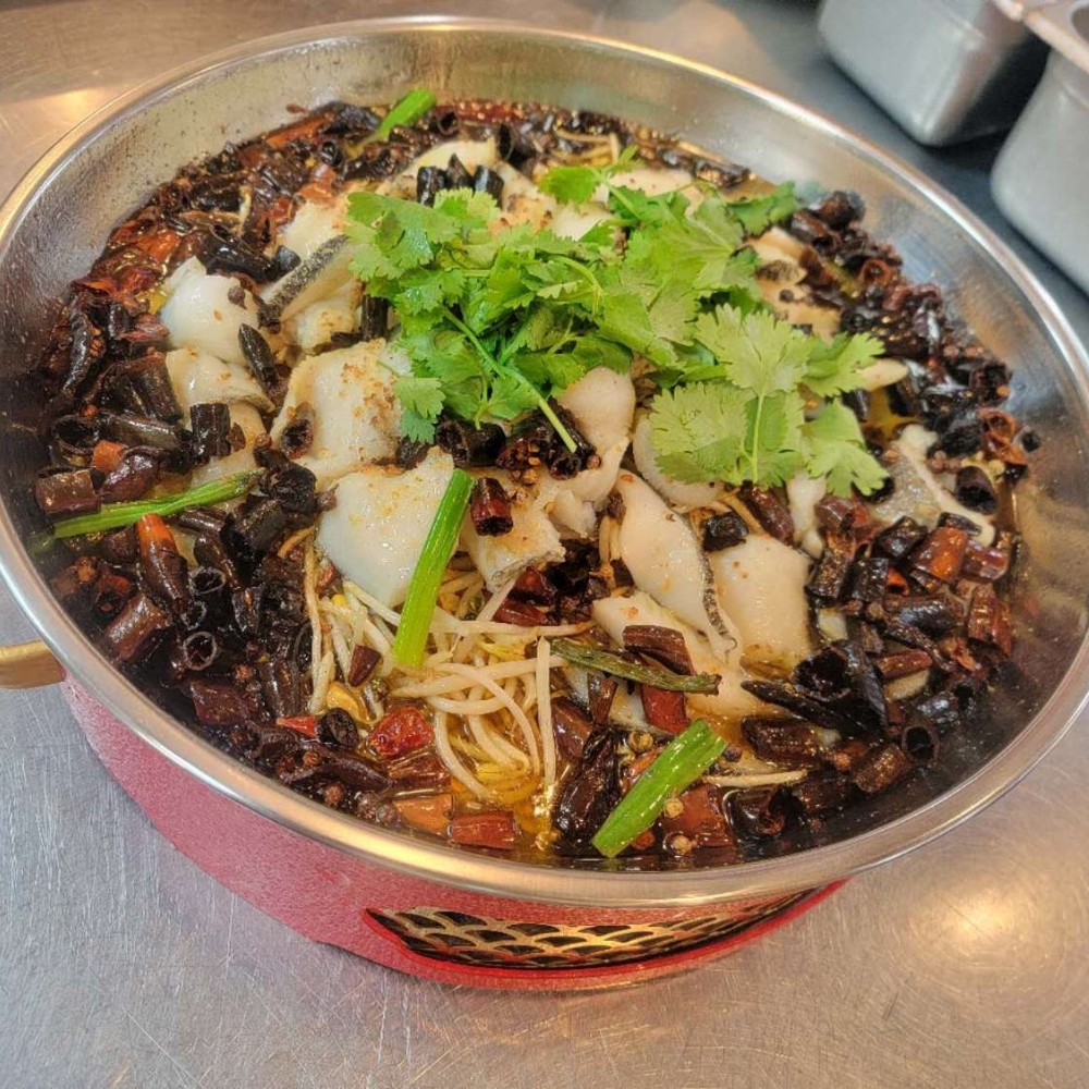 Spicy fish hot pot with chili, cilantro and bean sprouts at Farmer kitchen, a Chinese Restaurant in Monterey Park
