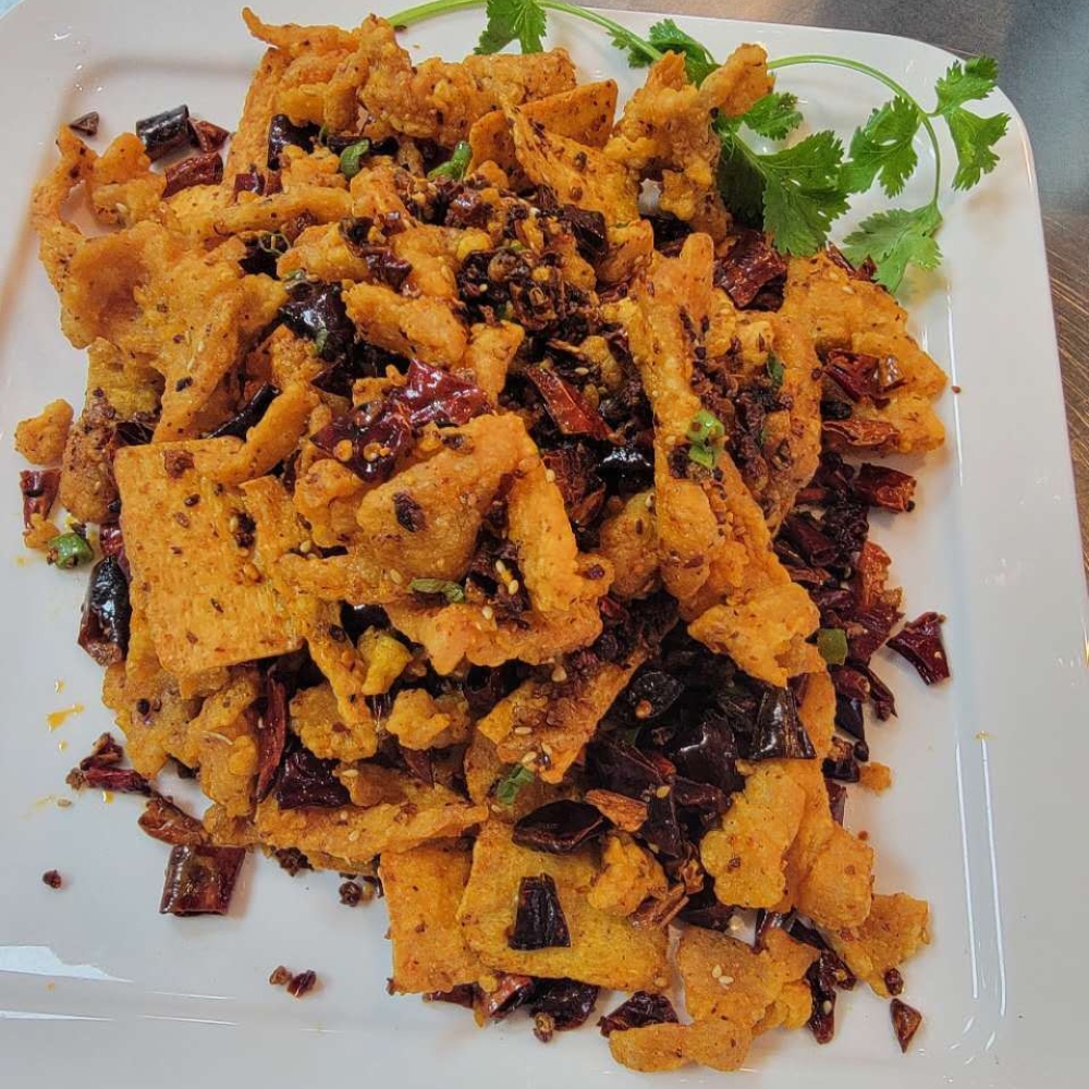 Spicy crispy pork with dried chili and tofu chips at Farmer kitchen, a Chinese Restaurant in Monterey Park
