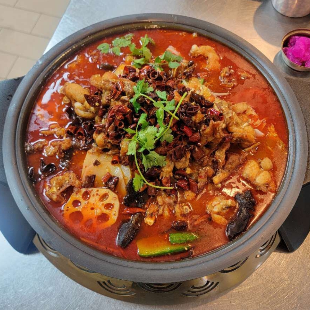 Farmer-kitchen-Chinese-Restaurant-Spicy-Frog-N-Hot-Pot-Monterey-Park Spicy frog hot pot with chili, lotus root and various ingredients at Farmer kitchen, a Chinese Restaurant in Monterey Park