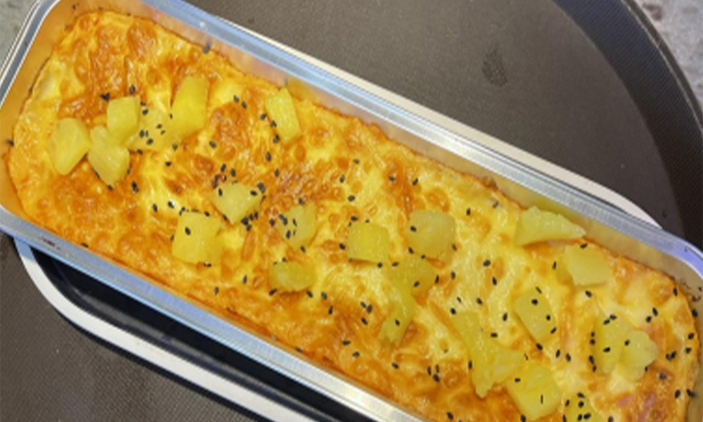 Baked cheesy sweet potato casserole with pineapple chunks at FENGMU, a Korean BBQ Restaurant in Rowland Heights