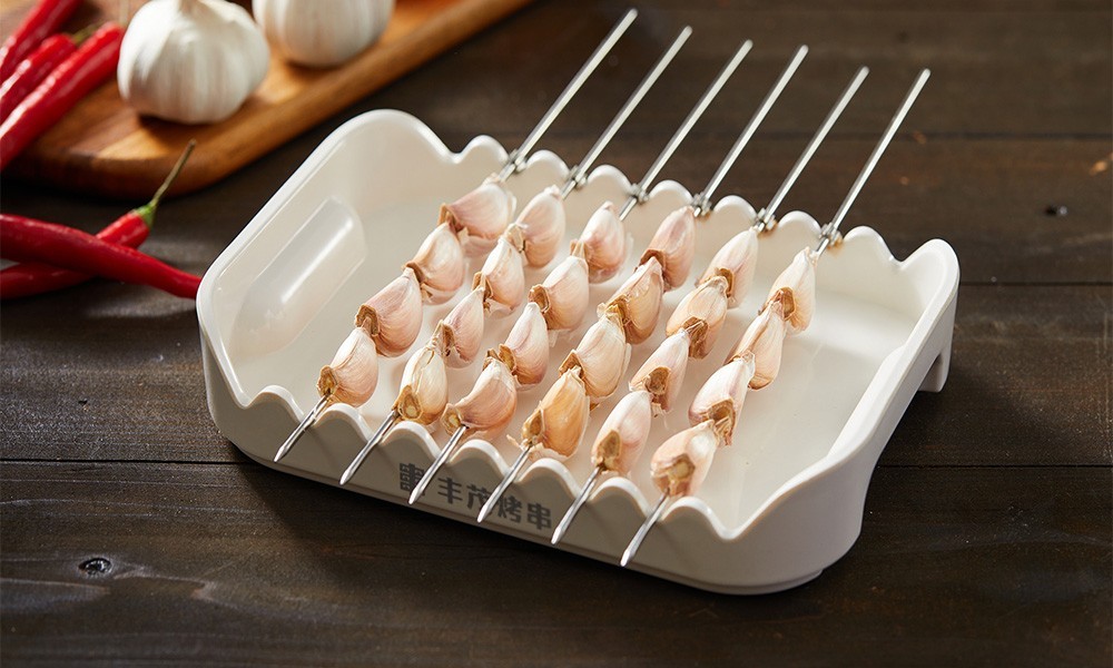 Grilled garlic cloves skewers at FENGMU, a Korean BBQ Restaurant in Rowland Heights