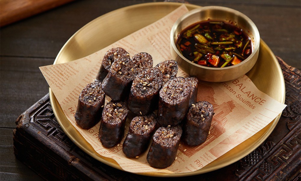 Korean-style blood sausage with rice, served with spicy dipping sauce at FENGMU, a Korean BBQ Restaurant in Rowland Heights