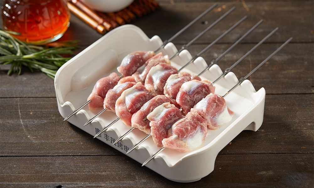 Raw marinated chicken gizzard skewers ready for grilling at FENGMU, a Korean BBQ Restaurant in Rowland Heights