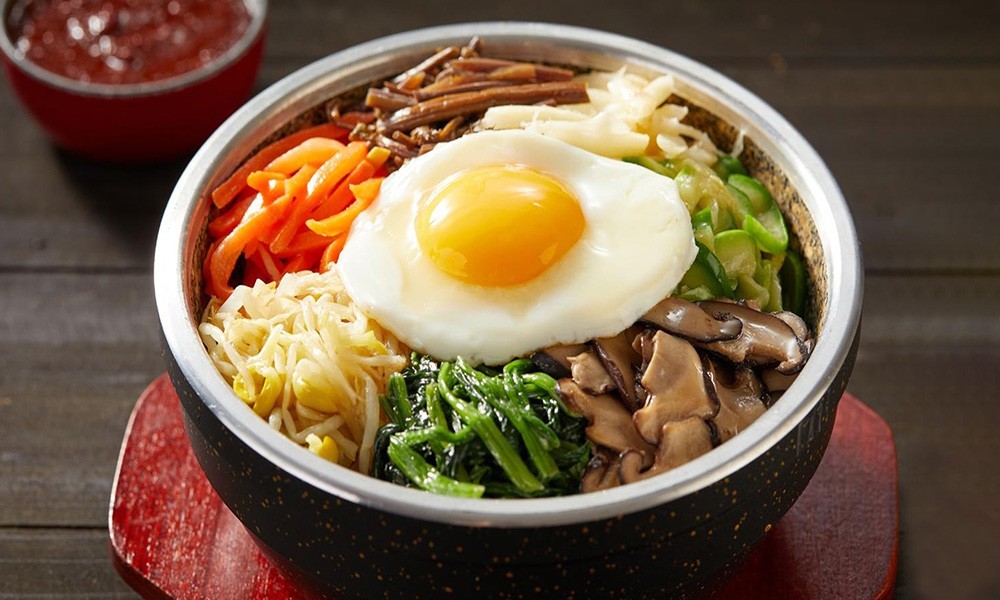 Stone pot bibimbap with fried egg and veggies at FENGMU, a Korean BBQ Restaurant in Rowland Heights
