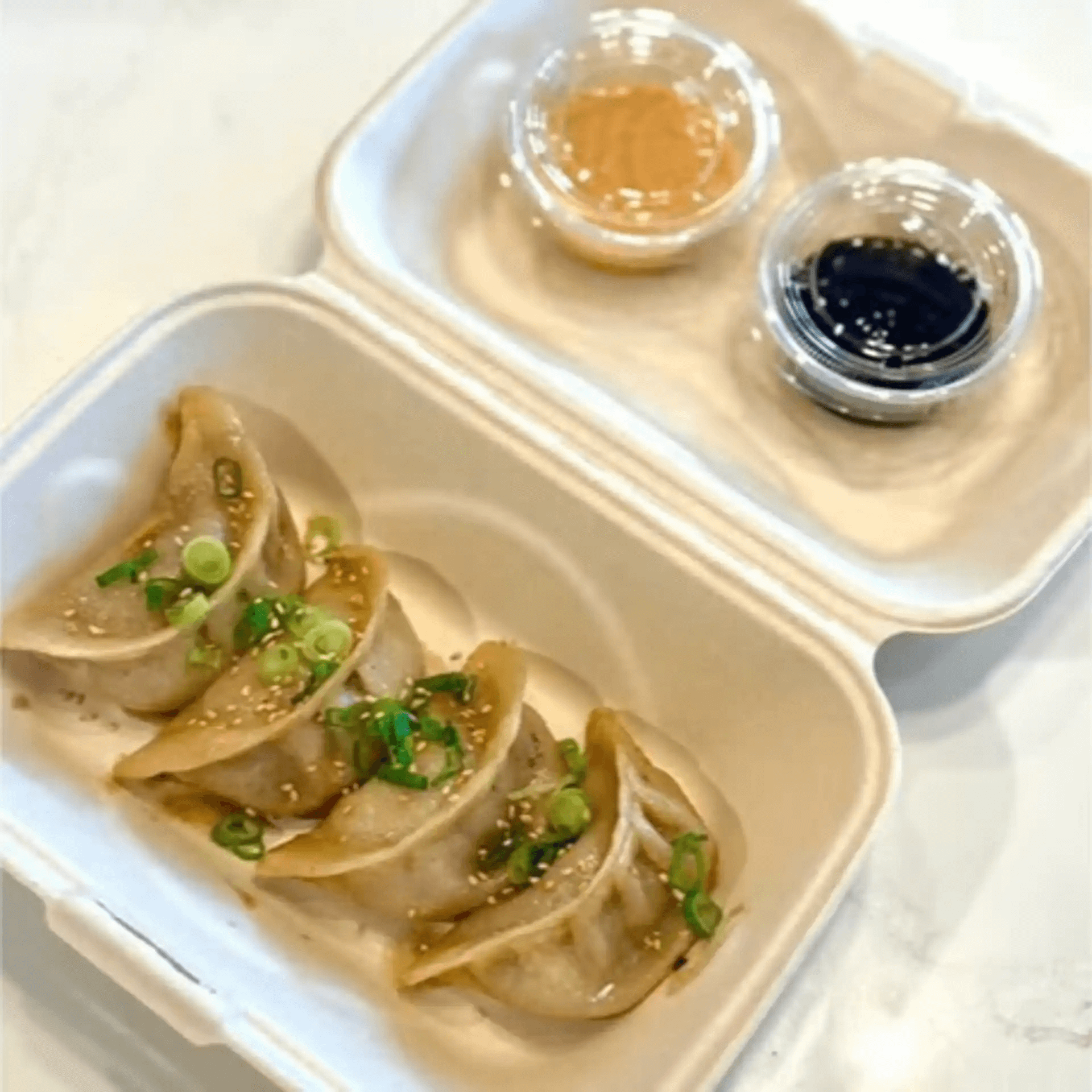 Chicken potstickers served with two dipping sauces at F-F IN BOWL, a Asian Fusion Restaurant in Santa Rosa