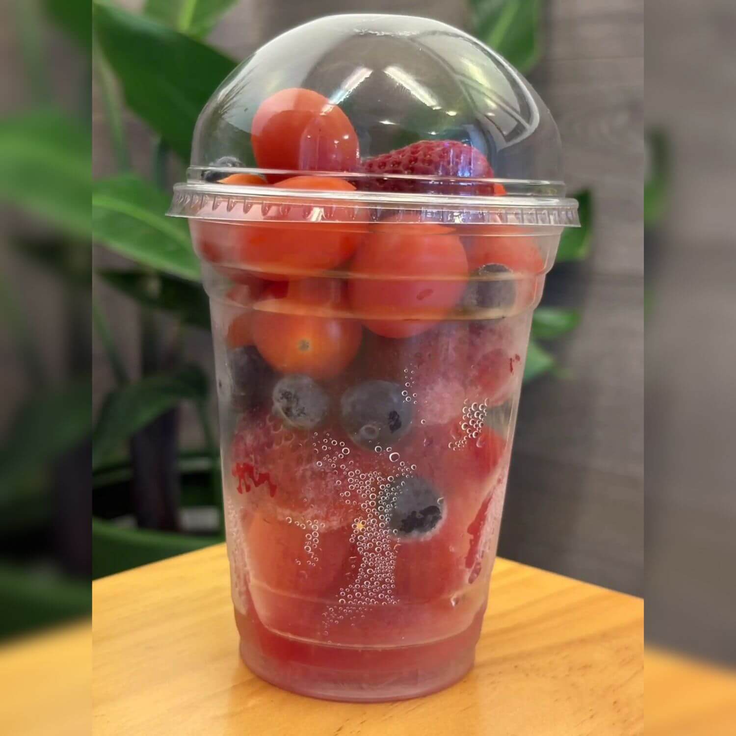 Cup with cherry tomatoes, strawberries and blueberries at F-F IN BOWL, a Asian Fusion Restaurant in Santa Rosa