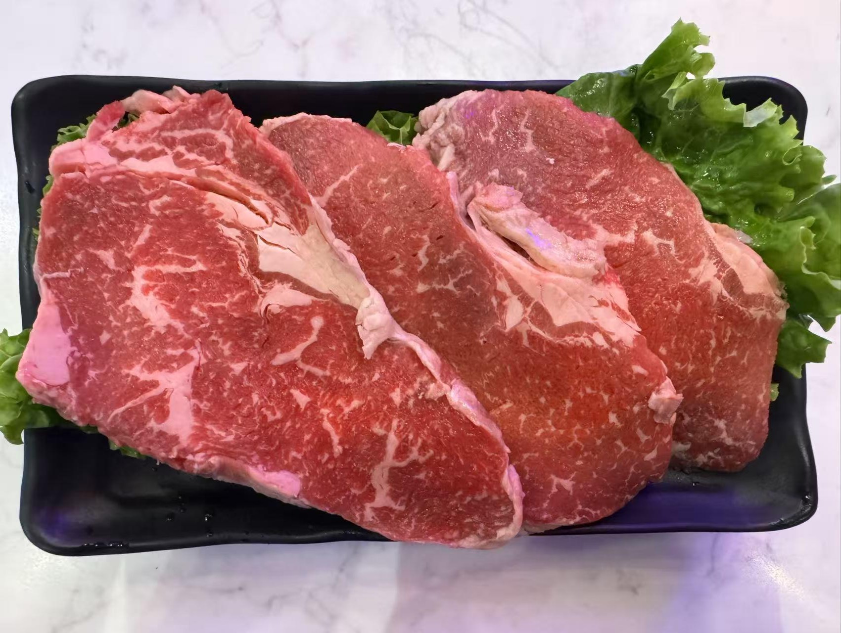 Fire-Pot-Korean-Barbecue-&-Hot-Pot-Restaurant-Beef-steak-Fort-Worth Juicy beef steak ready for grilling at Fire Pot,a Korean Barbecue & Hot Pot Restaurant in Fort Worth.