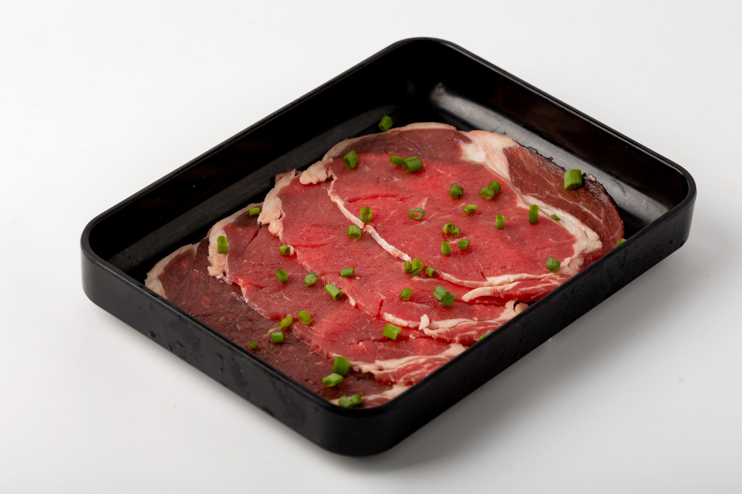 Fresh beef slices with chopped scallions at Firestone Hotpot & BBQ Restaurant in Tallahassee