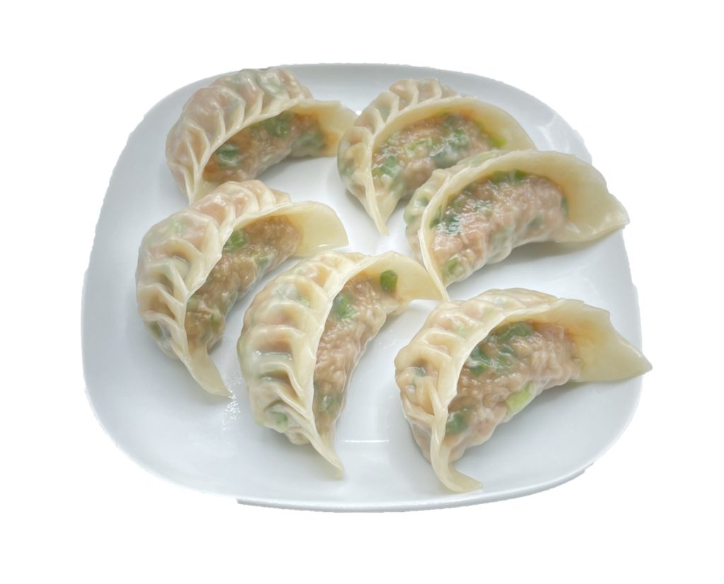 Open-faced steamed dumplings with pork filling at Fok Noodles Express, an Asian Restaurant in New York.