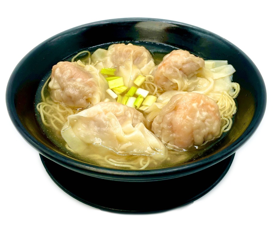 Shrimp wonton noodle soup in black bowl at Fok Noodles Express, an Asian Restaurant in New York.