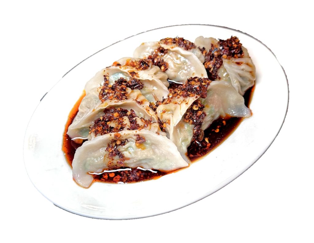 Spicy boiled dumplings with chili oil sauce at Fok Noodles Express, an Asian Restaurant in New York.
