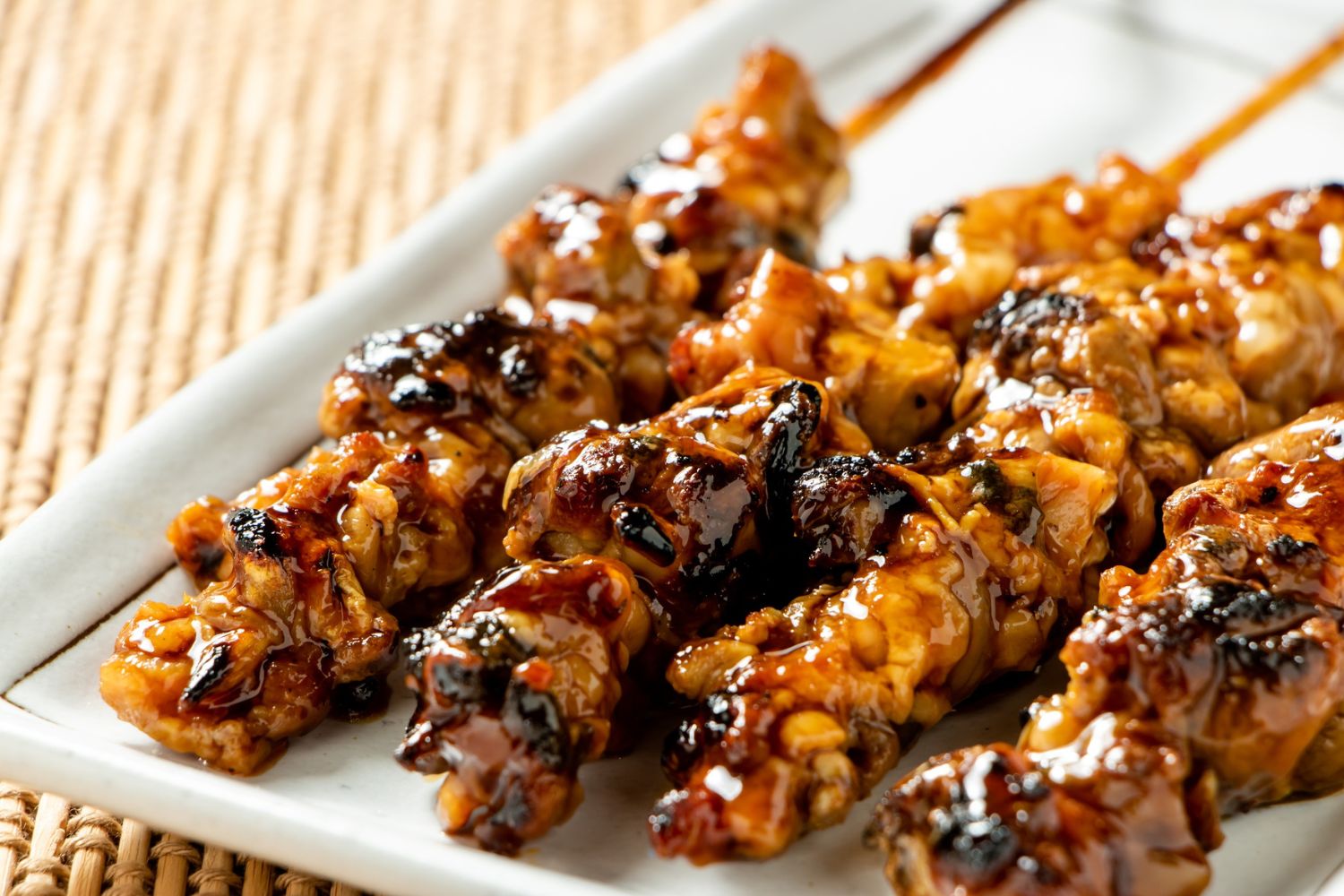 Grilled chicken skewers coated in barbecue sauce at Foodie BBQ & Bar, a Chinese Restaurant in New York