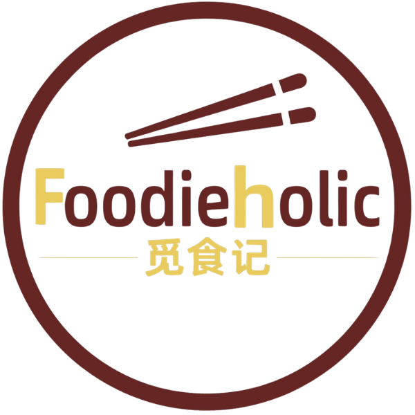 Circular Foodieholic logo with chopsticks and Chinese characters at Foodieholic Chinese Noodle & Kitchen, a Chinese restaurant in Durham