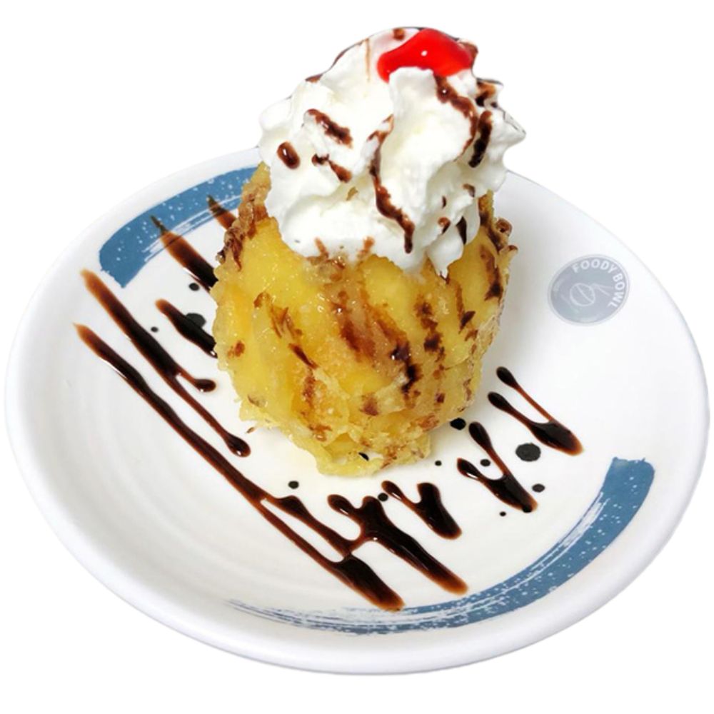 Foody-Bowl-Restaurant-Japanese-Restaurant-Fried-Pineapple-with-Ice-Cream-and-Chocolate-Sauce-Ocala Fried pineapple with ice cream, chocolate sauce, and a cherry at Foody Bowl Restaurant, a Japanese Restaurant in Ocala