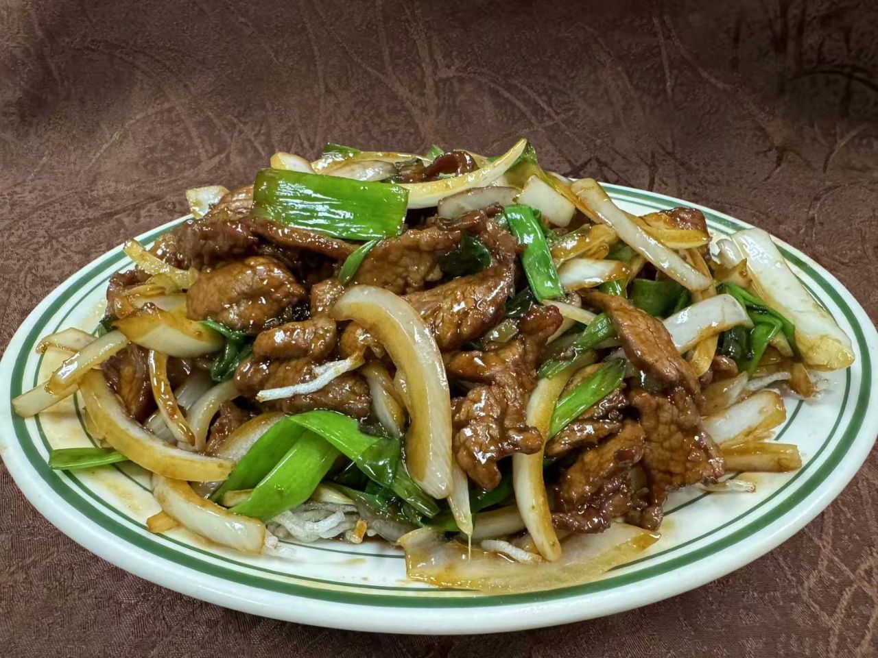 Tender beef with scallions and onions in savory sauce at Forbidden City Chinese Restaurant in Westminster