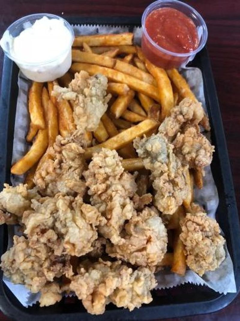 Fried seafood platter with french fries and two side dipping sauces