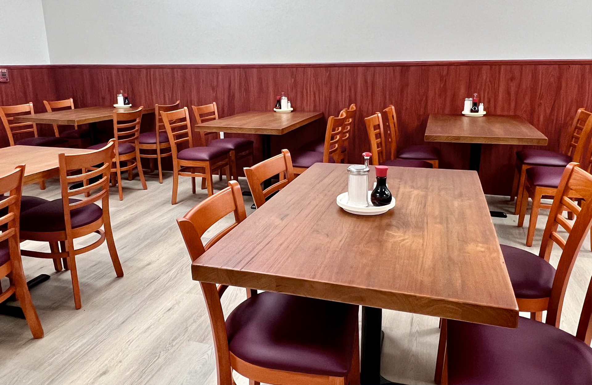 Fortune-Garden-Chinese-restaurant-Dining-Area-Soledad Clean dining area with wooden tables, chairs and condiments at Fortune Garden, a Chinese restaurant in Soledad