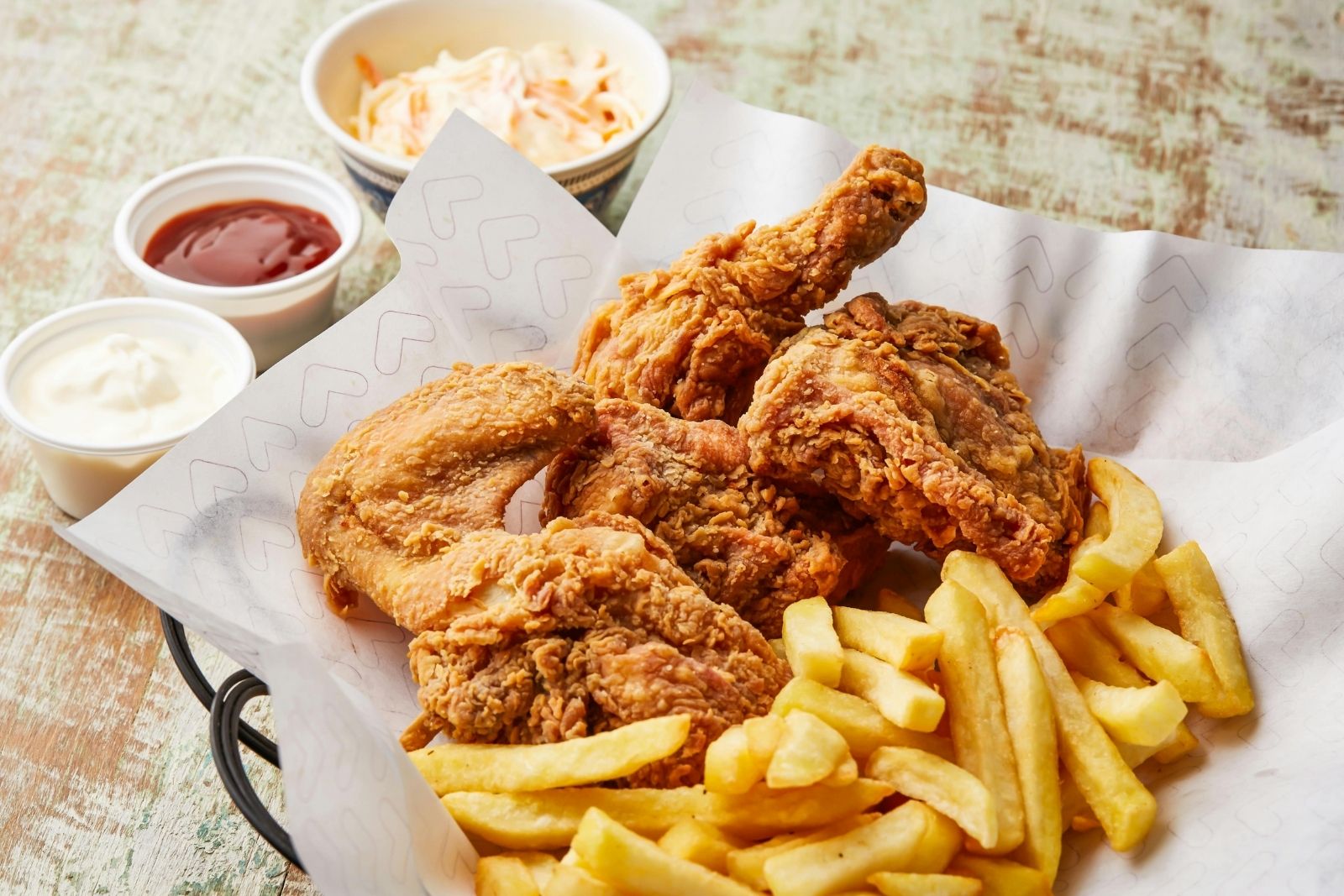 Fried chicken meal with fries and coleslaw at Frank’s Hot Chicken, a Fast - Food Restaurant in Jonesboro