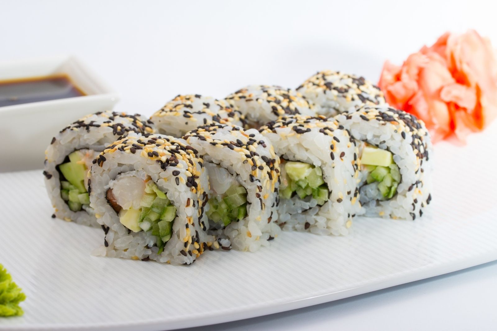 Shrimp avocado maki roll coated with mixed black and white sesame seeds at Fuji Asian Cuisine, an Asian Restaurant in Sylacauga
