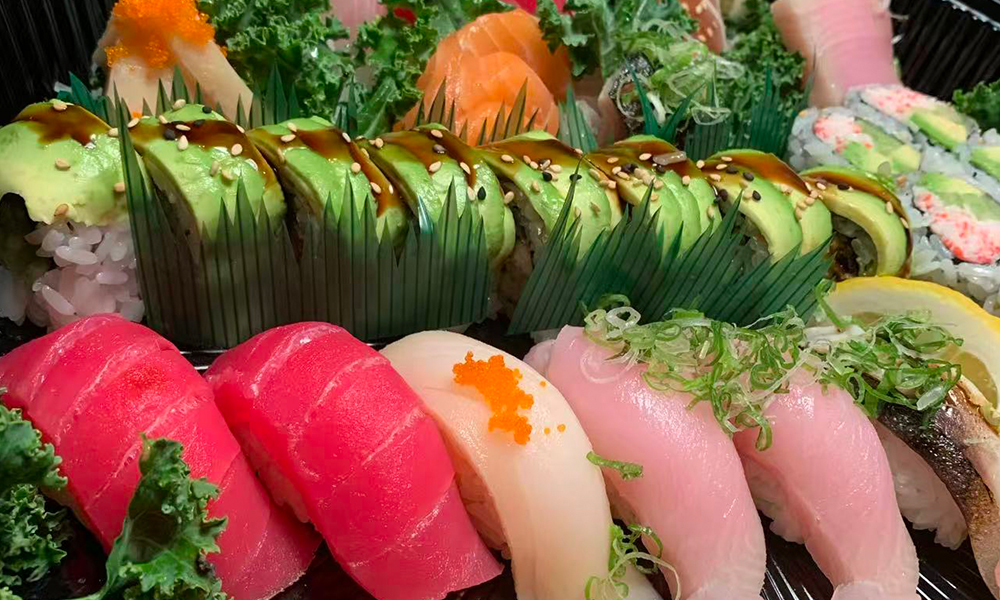 Avocado sushi roll paired with various sashimi. Aburi Salmon Sushi Roll at Fuji Hibachi&Sushi in Monroe