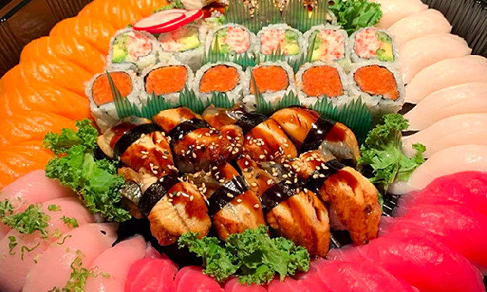 Luxurious platter of assorted sushi and sashimi. Aburi Salmon Sushi Roll at Fuji Hibachi&Sushi in Monroe