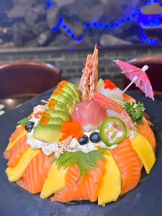 Fuji-Hibachi-&-Sushi-Steakhouse-Japanese-Restaurant-Salmon-and-Mango-Sushi-Stack-Edgewater Salmon and Mango Sushi Stack - Layered sushi with salmon, mango, and avocado at Fuji Hibachi & Sushi Steakhouse, a Japanese restaurant in Edgewater