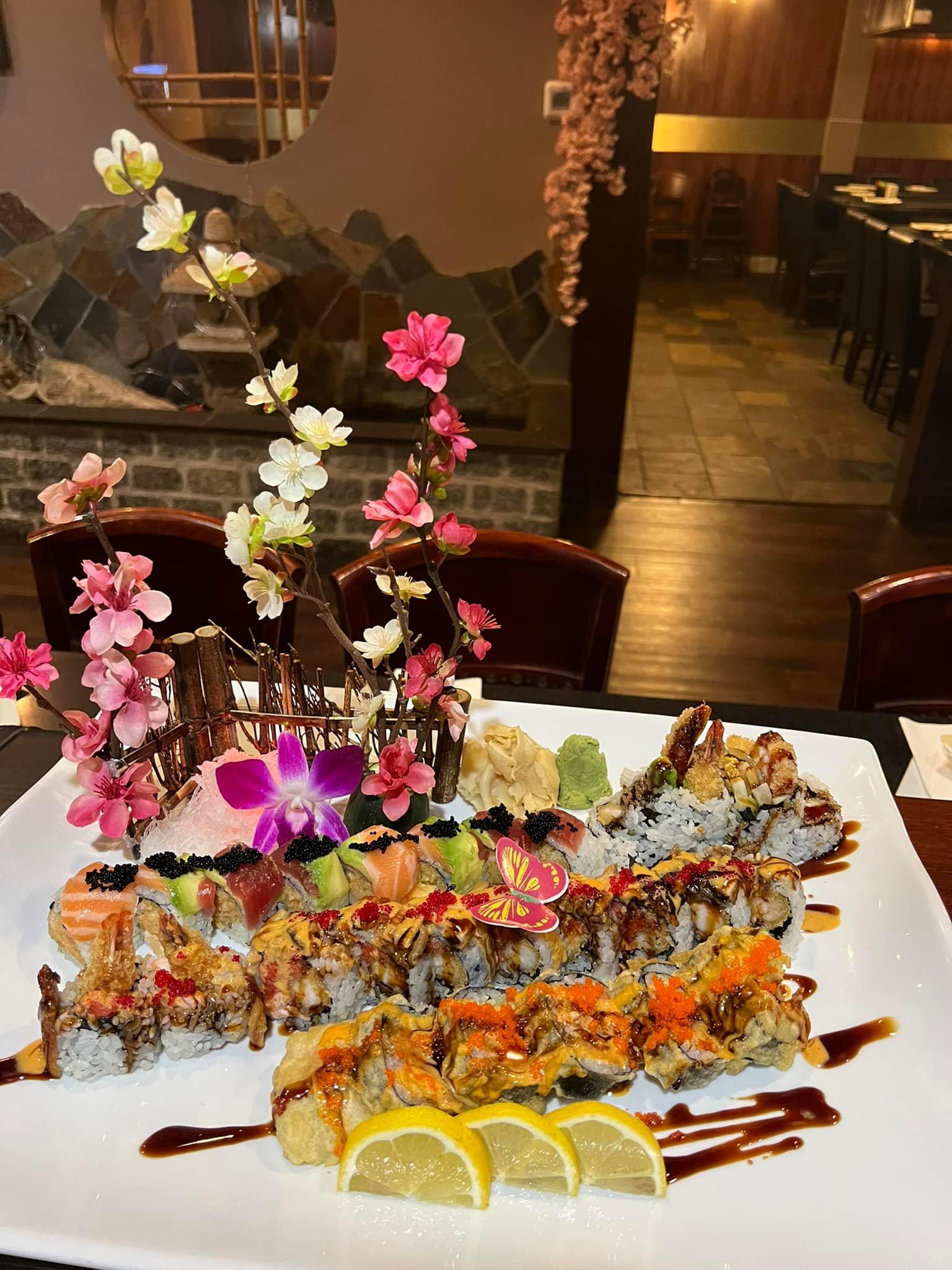 Fuji-Hibachi-&-Sushi-Steakhouse-Japanese-Restaurant-Sushi-Platter-1-Edgewater Sushi Platter 1 - Assorted sushi rolls and nigiri, artistically arranged with flowers at Fuji Hibachi & Sushi Steakhouse, a Japanese restaurant in Edgewater