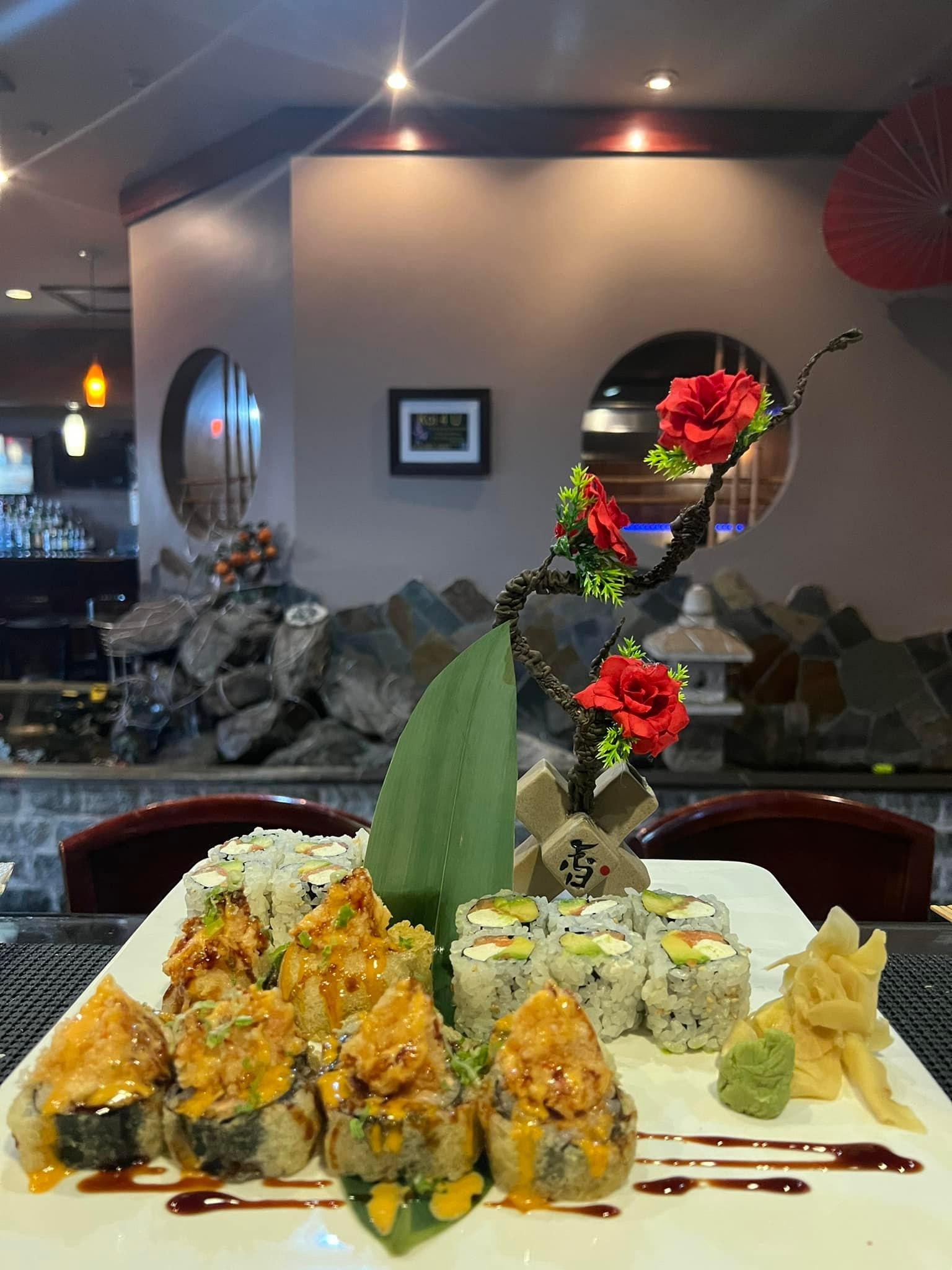 Fuji-Hibachi-&-Sushi-Steakhouse-Japanese-Restaurant-Sushi-Platter-2-Edgewater Sushi Platter 2 - Variety of sushi, including rolls and sashimi, decorated with blossoms at Fuji Hibachi & Sushi Steakhouse, a Japanese restaurant in Edgewater