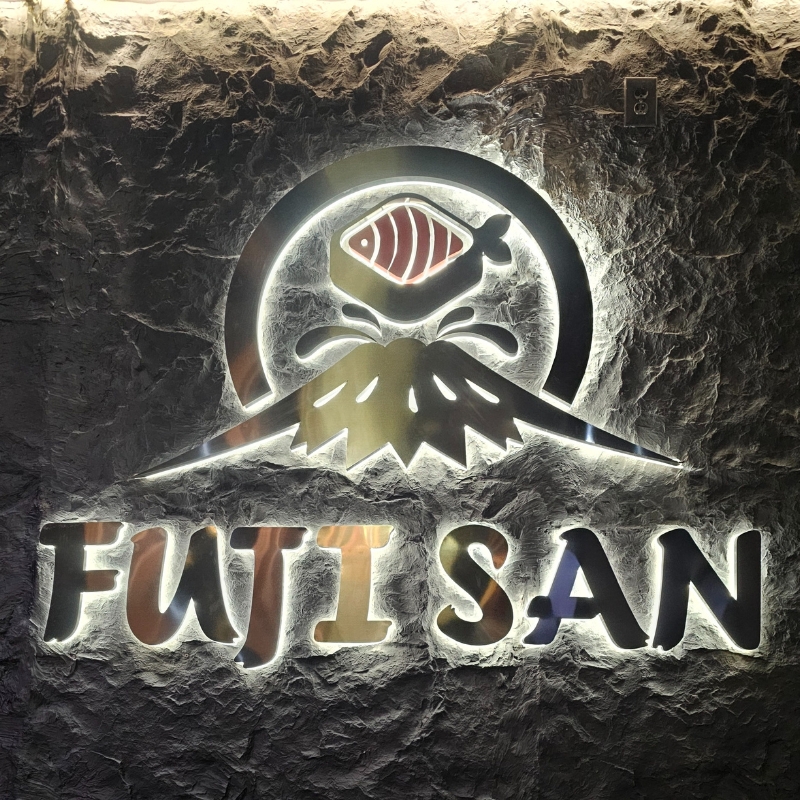 The restaurant's logo with a fish and mountain design at Fujisan, a Japanized Western Restaurant in Chandler