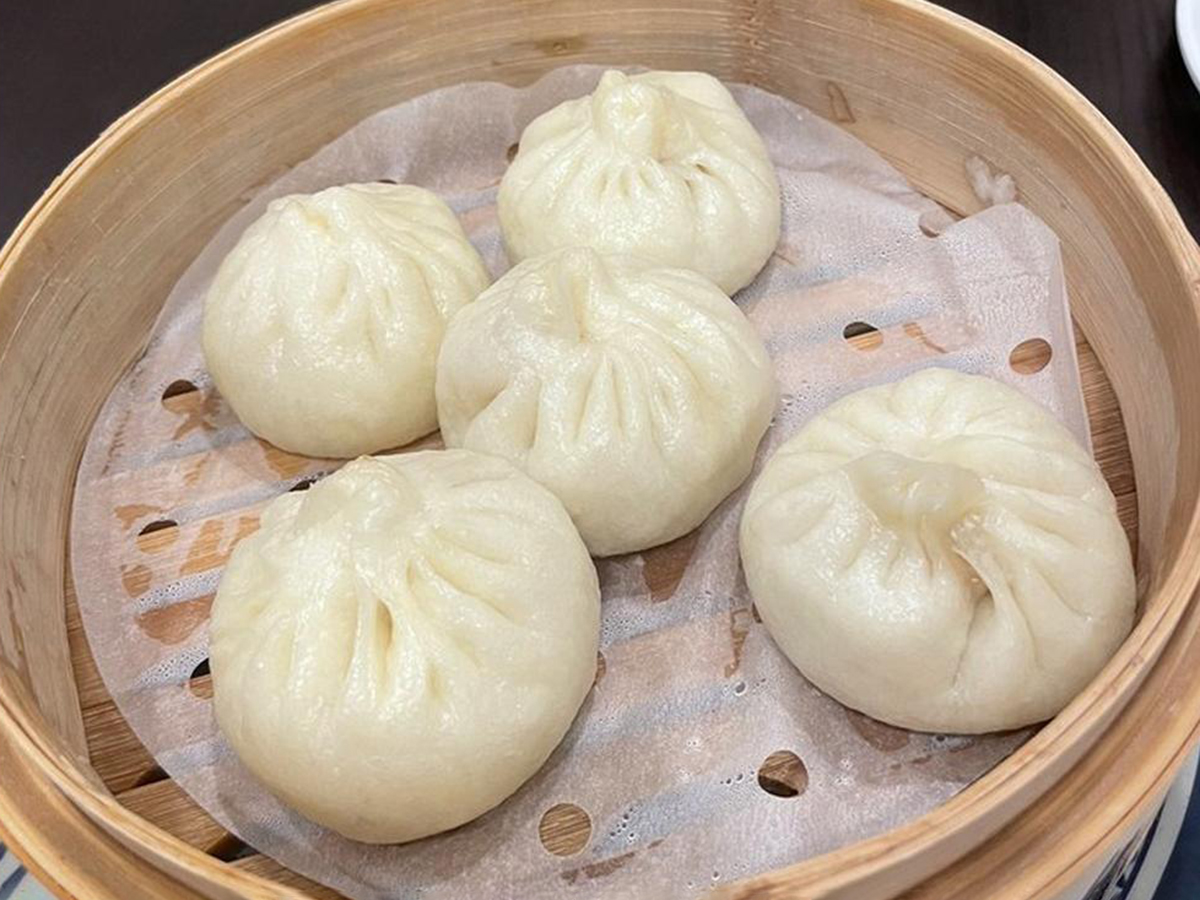 Steamed buns in bamboo steamer, white and plump at Fun Noodle Bar Amarillo, a Asian restaurant in Amarillo