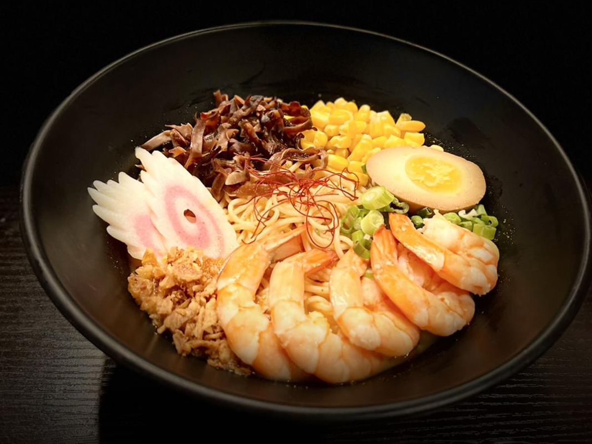 Shrimp ramen with soft - boiled egg & fish cake, neat plating at Fun Noodle Bar Amarillo, a Asian restaurant in Amarillo