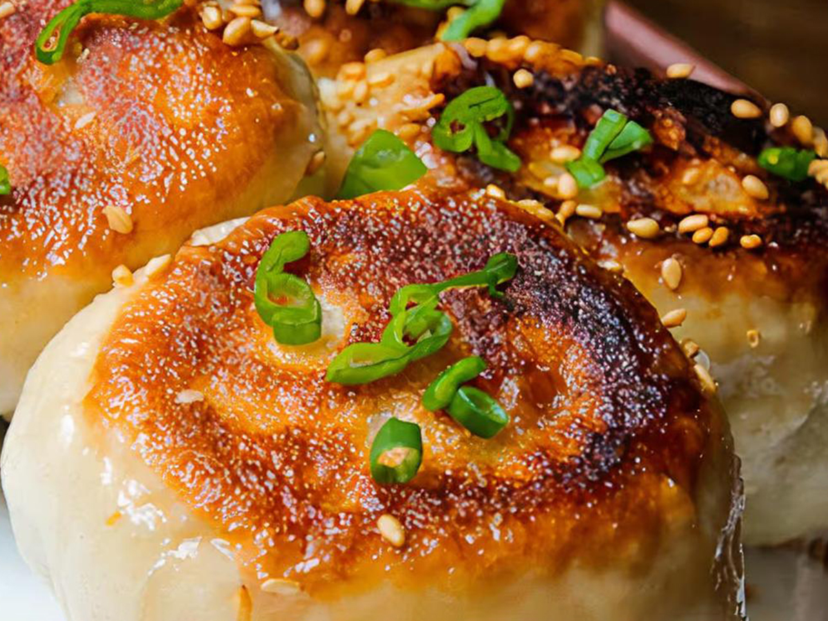 Pan - fried buns, crispy bottom with scallions at Fun Noodle Bar Amarillo, a Asian restaurant in Amarillo
