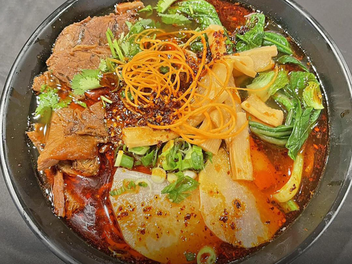 Spicy ramen with various ingredients, rich color at Fun Noodle Bar Amarillo, a Asian restaurant in Amarillo